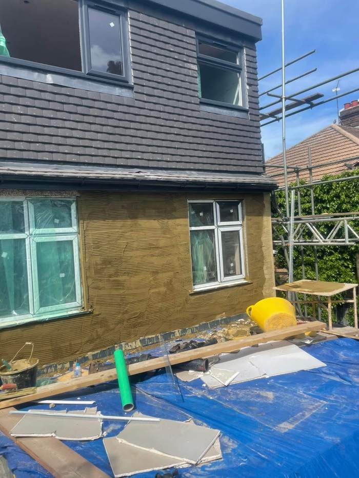 Scratch coat of render on a side extension