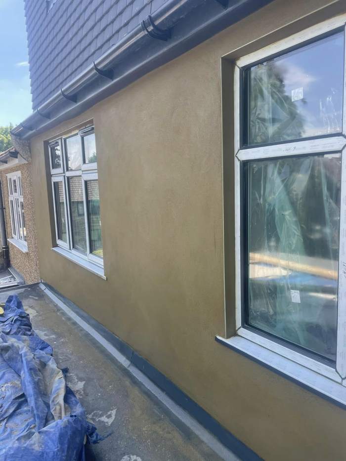 Smooth finished render beside new windows